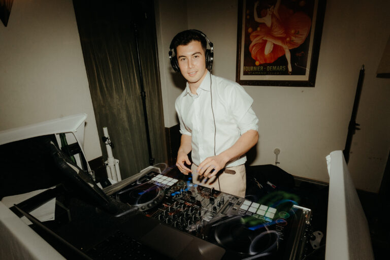 DJ inside the control room looking at the camera, surrounded by ready music systems - Canberra Dj, 8 til late - gallery